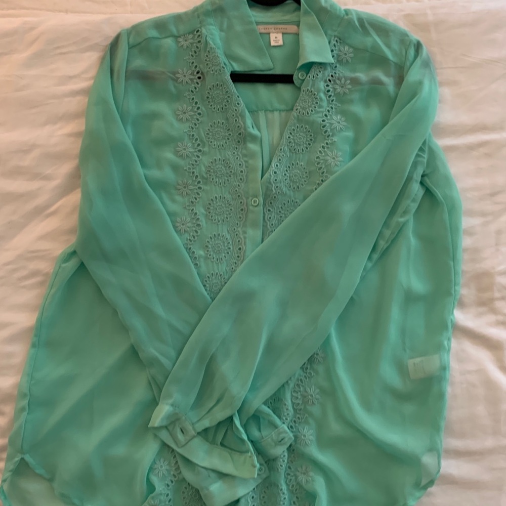Sheer top, with floral design down the buttons.